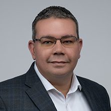 A headshot photo of Izzy Cruz.