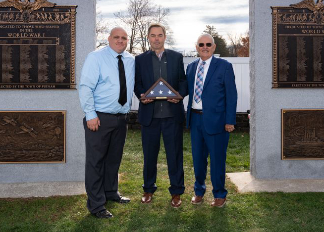 Group photo from the Putnam Veterans Memorial. Photographed from left to right are Robert Challinor, Jr., representative of the Putnam Veterans Advisory Committee, Robert J. Morton, president and CEO of bankHometown, and Barney Seney, mayor of Putnam, CT.