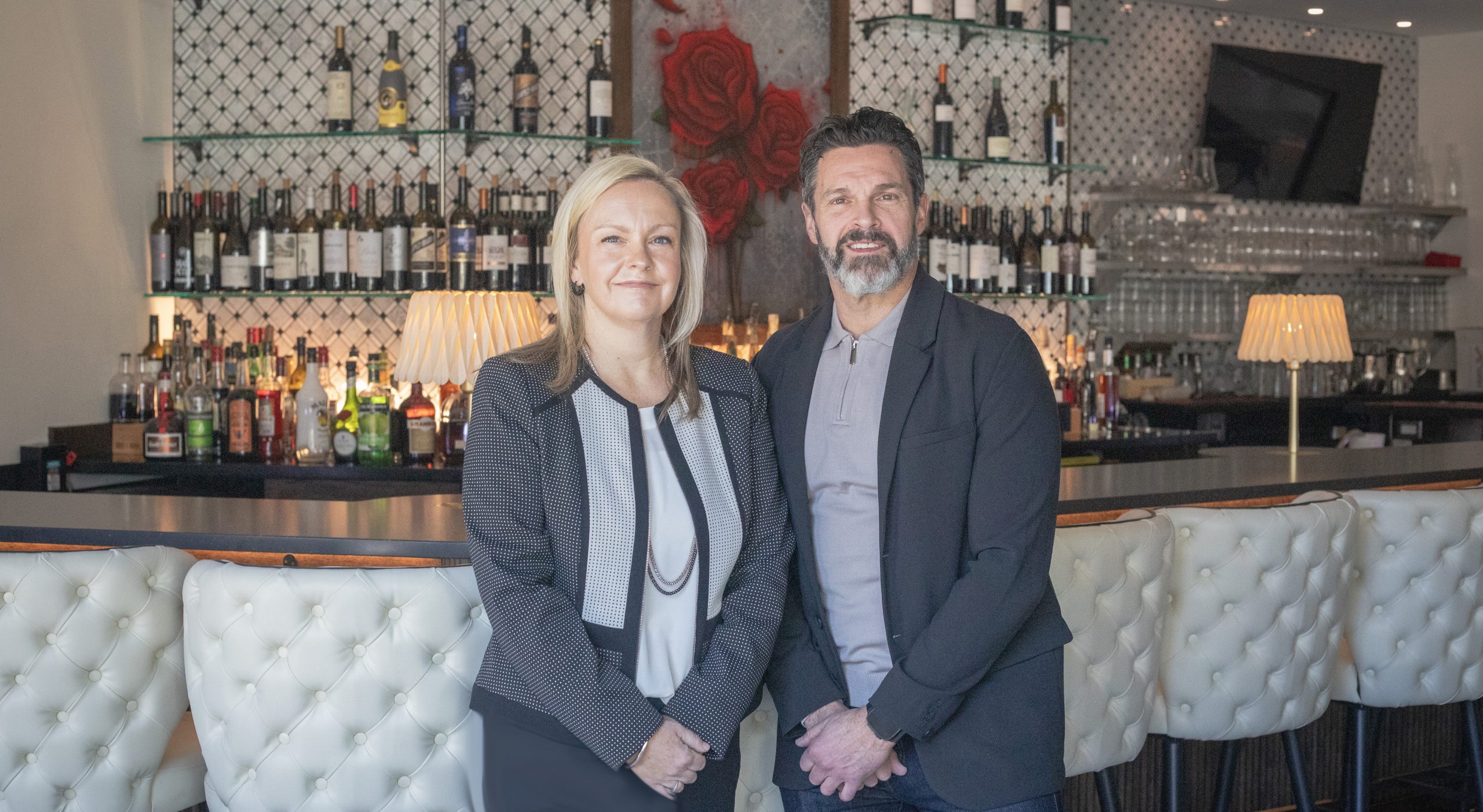 Restaurant owner, Michael Covino and with bank commercial lender, in front of his restaurant.