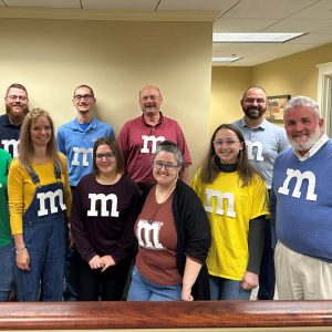 Bank employees dressed up as m&m's for Halloween.