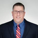 A headshot of Jason Howard.