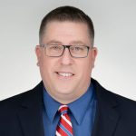 A headshot of Jason Howard.