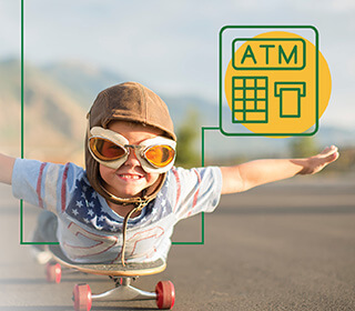 A boy with googles and a helmet riding on a skateboard with this arms stretch out at his sides.