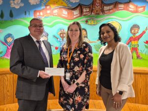 Isabelo Cruz Lopez, branch manager, bankHometown; Lauren Racca, principal, Quinsigamond Elementary School; Meenakshi Sharma, branch manager, bankHometown 