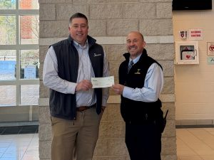 Jason Howard, branch manager, bankHometown; Dr. Peter Dufresne, principal, Tantasqua Regional High School