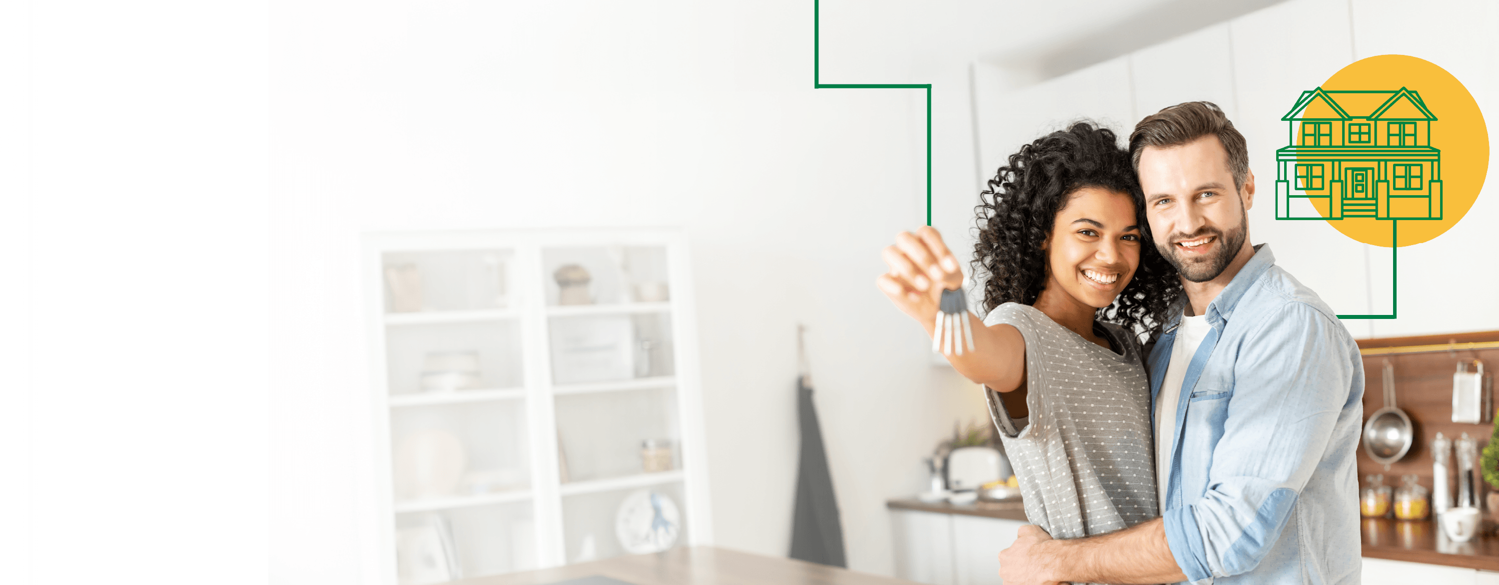 A woman and man holding up a house key in their new home.